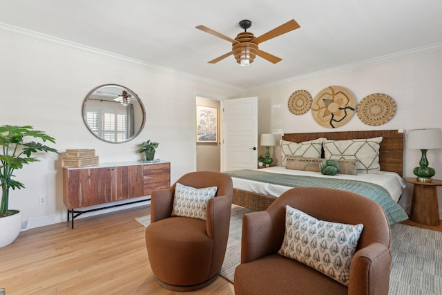 bedroom with crown molding, baseboards, a ceiling fan, and light wood-type flooring