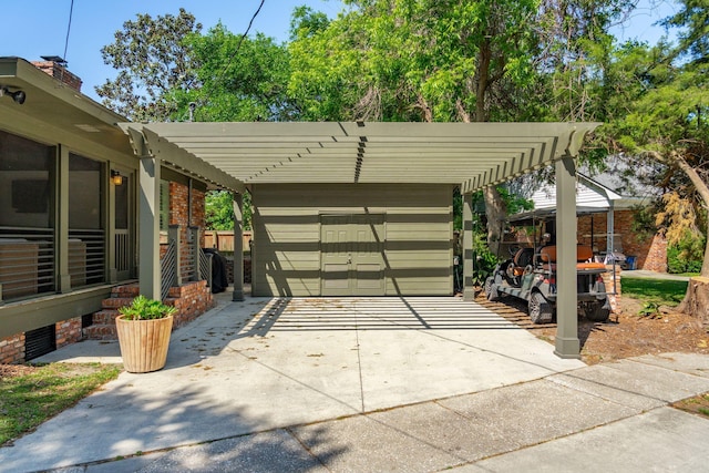 exterior space with concrete driveway and a carport