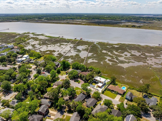 drone / aerial view with a residential view and a water view