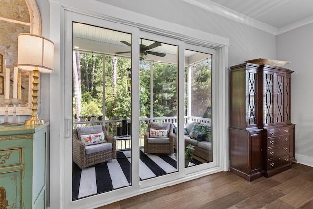 129 Martins Point Dr, Wando, SC 29492 - doorway featuring dark wood-type flooring, ceiling fan, and ornamental molding