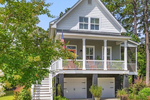 129 Martins Point Dr, Wando, SC 29492 - coastal home with stairs, an attached garage, covered porch, and concrete driveway
