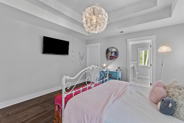 129 Martins Point Dr, Wando, SC 29492 - bedroom with a raised ceiling, wood finished floors, and ensuite bathroom