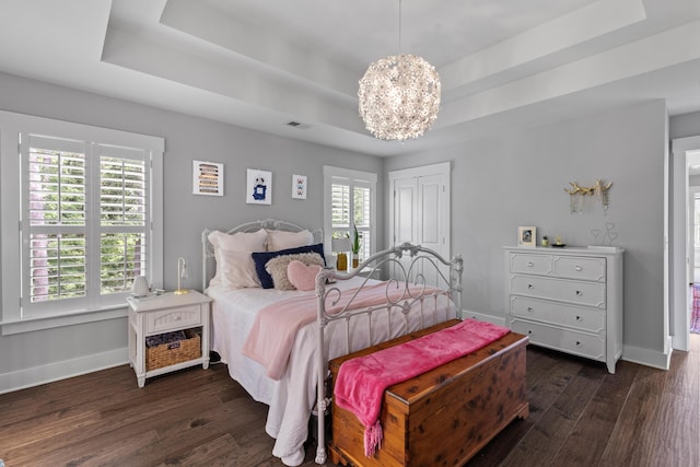 129 Martins Point Dr, Wando, SC 29492 - bedroom featuring a tray ceiling, dark wood-style floors, and a chandelier