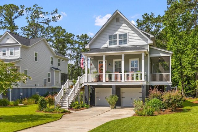 129 Martins Point Dr, Wando, SC 29492 - view of front of home with stairway, a front yard, a garage, driveway, and a porch