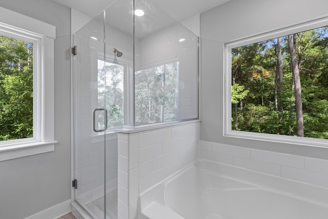 129 Martins Point Dr, Wando, SC 29492 - bathroom featuring a bath and a shower stall