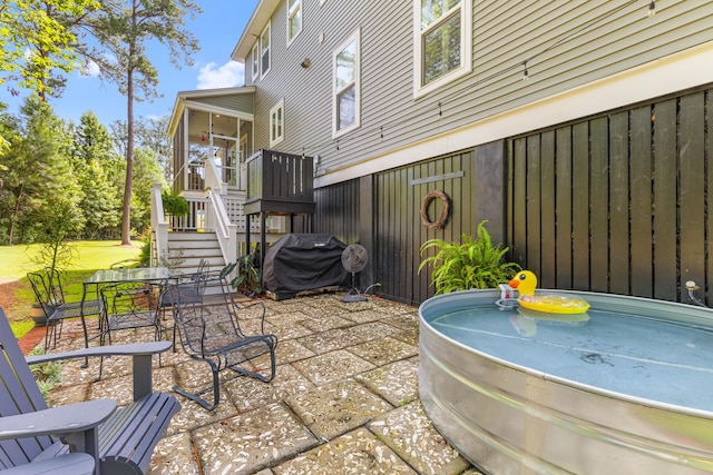 129 Martins Point Dr, Wando, SC 29492 - view of patio / terrace featuring stairs, a grill, a sunroom, and a hot tub