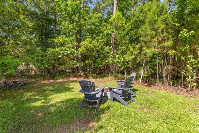 129 Martins Point Dr, Wando, SC 29492 - view of green lawn featuring a fire pit