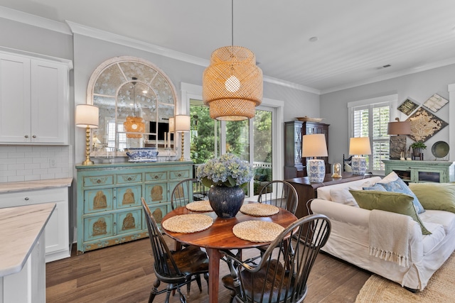 129 Martins Point Dr, Wando, SC 29492 - dining area featuring dark wood-style flooring and crown molding