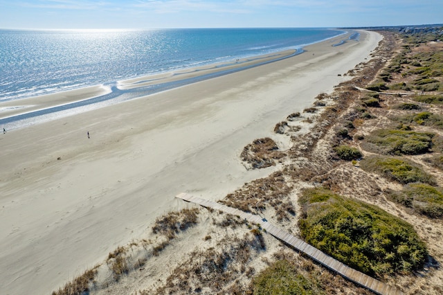 aerial view featuring a water view and a view of the beach