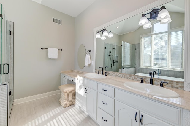 full bathroom with a stall shower, visible vents, a sink, and double vanity