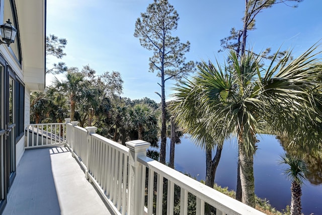 balcony featuring a water view