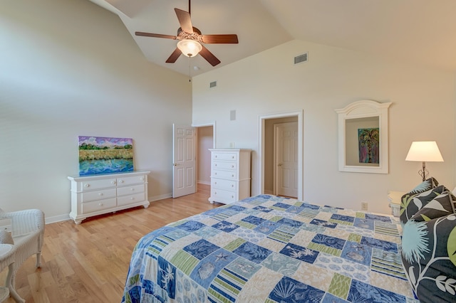 bedroom with high vaulted ceiling, a ceiling fan, visible vents, and wood finished floors