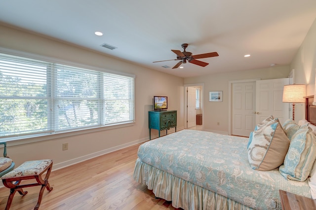 bedroom with baseboards, visible vents, light wood-style flooring, and recessed lighting