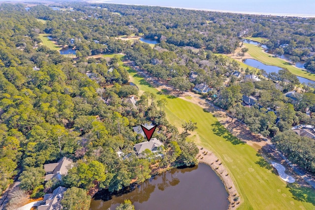 drone / aerial view with a water view and a wooded view