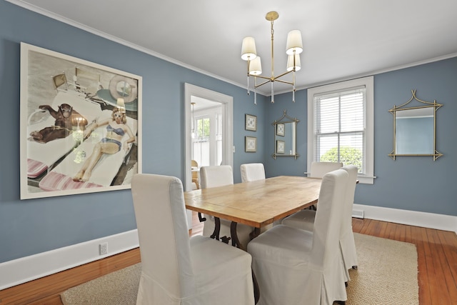 2060 Wappoo Hall Rd, Charleston, SC 29412 - dining room with a chandelier, wood-type flooring, crown molding, and baseboards
