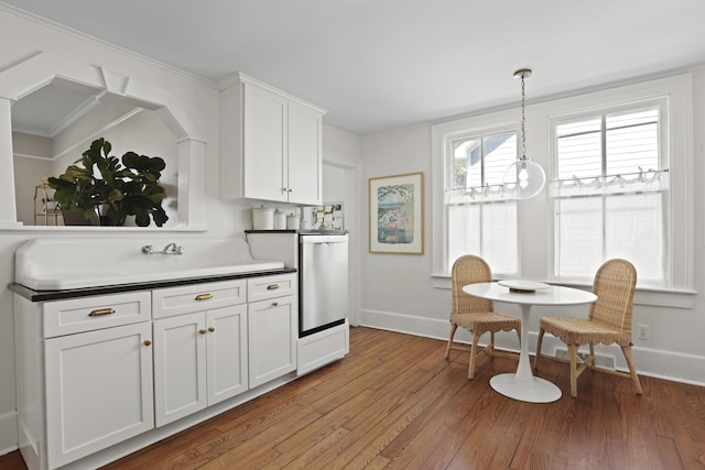 2060 Wappoo Hall Rd, Charleston, SC 29412 - kitchen with baseboards, light wood-type flooring, white cabinetry, and decorative light fixtures