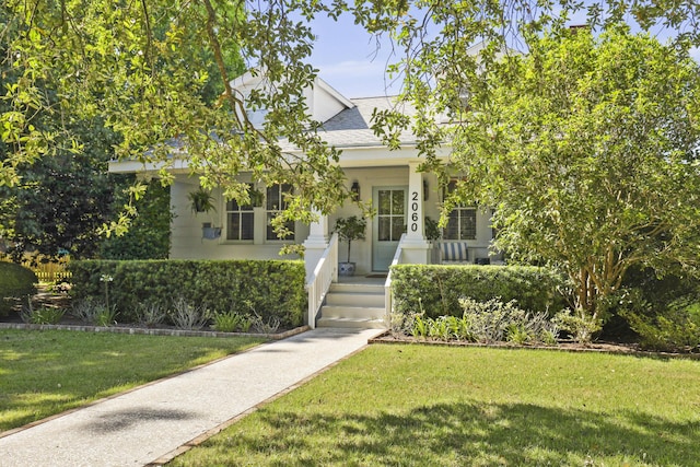 2060 Wappoo Hall Rd, Charleston, SC 29412 - view of front facade with a front lawn, a shingled roof, and stucco siding