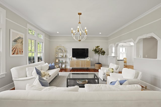 2060 Wappoo Hall Rd, Charleston, SC 29412 - living area featuring a chandelier, wood finished floors, arched walkways, baseboards, and ornamental molding