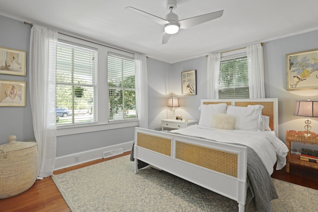 2060 Wappoo Hall Rd, Charleston, SC 29412 - bedroom featuring multiple windows, wood finished floors, and ceiling fan