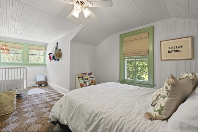 2060 Wappoo Hall Rd, Charleston, SC 29412 - bedroom with vaulted ceiling, carpet flooring, a ceiling fan, baseboards, and wooden walls