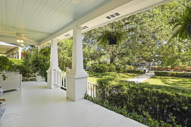2060 Wappoo Hall Rd, Charleston, SC 29412 - covered porch with a lawn and a ceiling fan