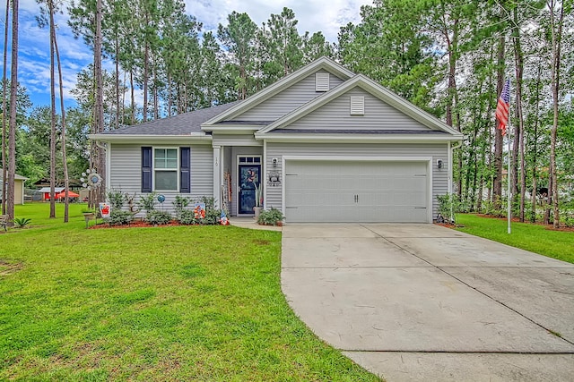 view of front of property with a garage and a front lawn