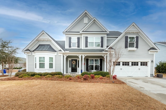 craftsman inspired home featuring a porch and a garage