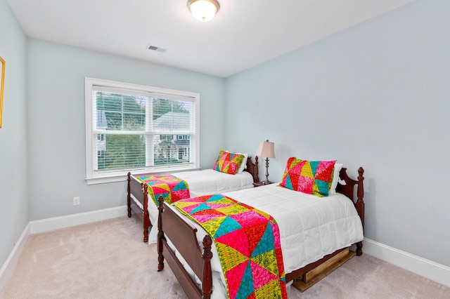 bedroom with light carpet