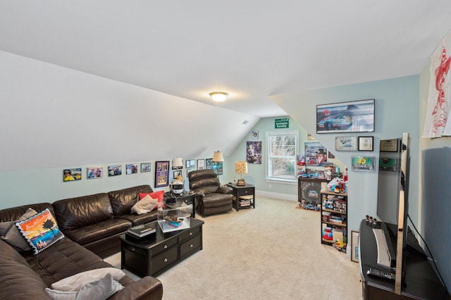 carpeted living room with vaulted ceiling