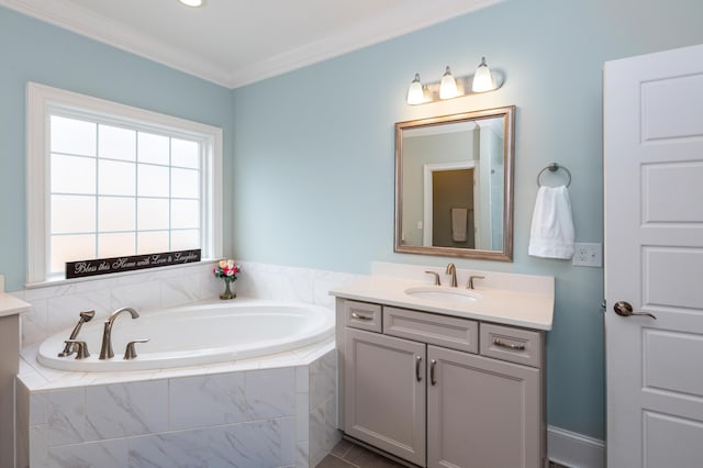 bathroom featuring vanity, a relaxing tiled tub, tile patterned floors, and ornamental molding