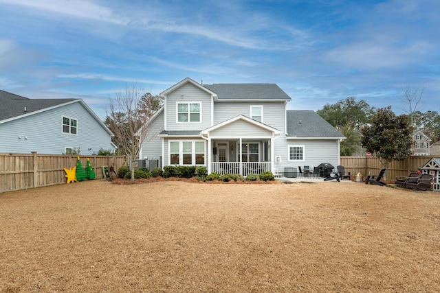 back of house with a sunroom and a patio