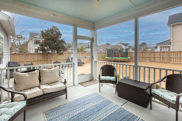 sunroom / solarium with ceiling fan