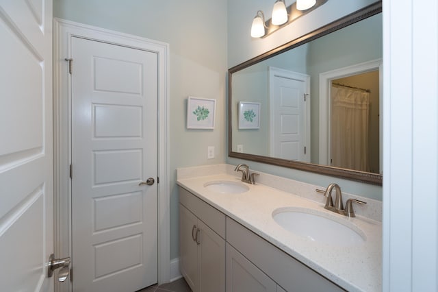 bathroom featuring tile patterned floors and vanity