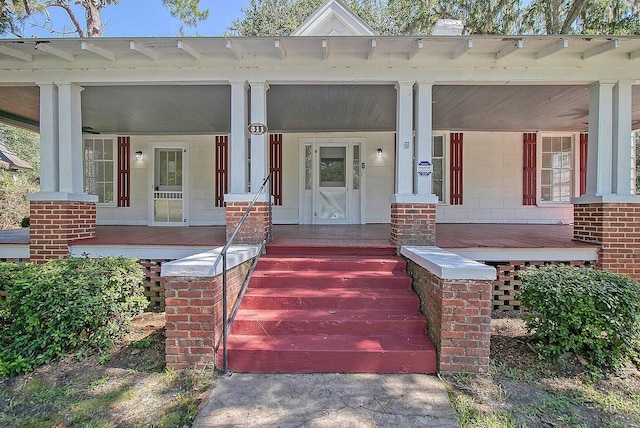 doorway to property with a porch