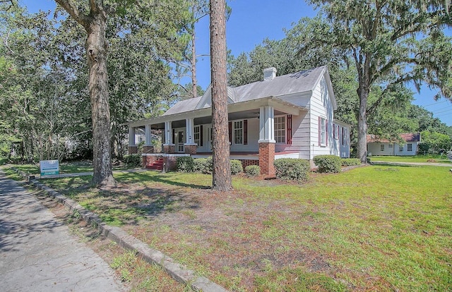 exterior space with a front lawn and covered porch