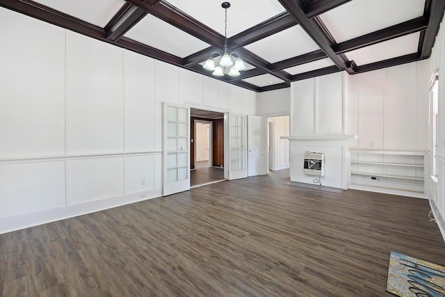 unfurnished living room featuring dark hardwood / wood-style floors, coffered ceiling, and beam ceiling