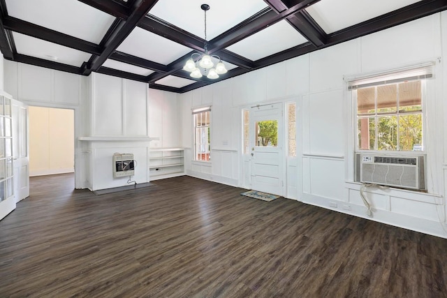 unfurnished living room featuring coffered ceiling, a fireplace, plenty of natural light, and dark wood-type flooring