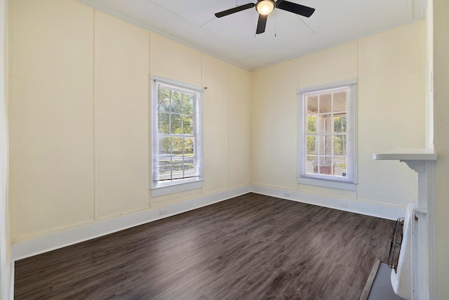 spare room featuring ceiling fan and dark hardwood / wood-style floors