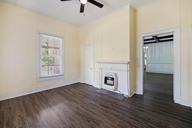 unfurnished living room featuring crown molding, ceiling fan, dark hardwood / wood-style floors, and heating unit