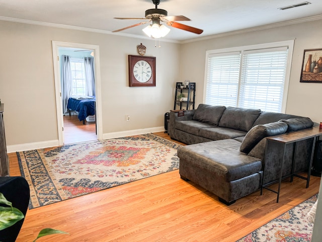 living room with ceiling fan, hardwood / wood-style floors, and crown molding