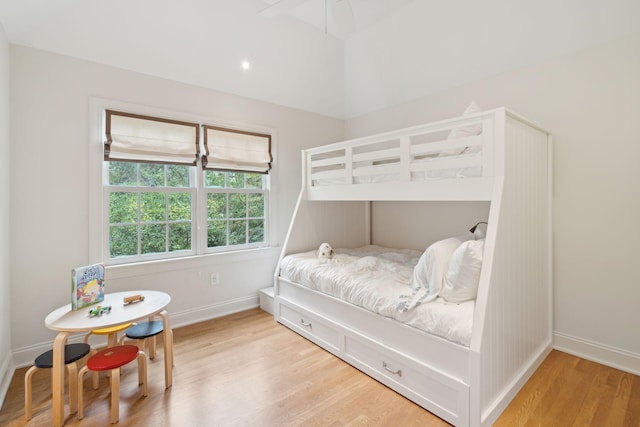 bedroom with ceiling fan and light hardwood / wood-style floors