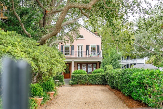 view of front of house with a balcony