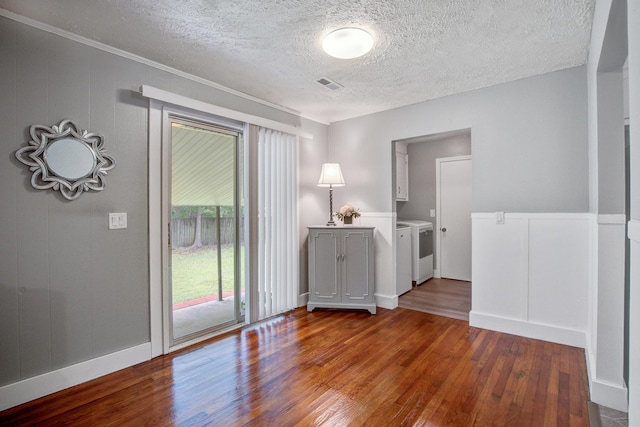 110 Terry Ave, Summerville, SC 29485 - spare room with washer and dryer, wood finished floors, a textured ceiling, a decorative wall, and baseboards