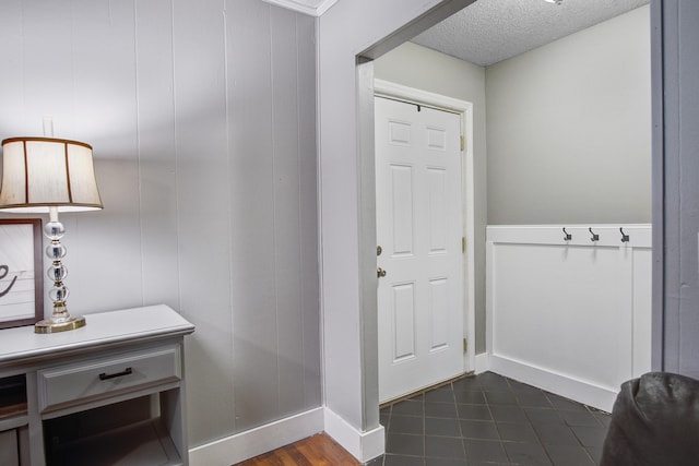 110 Terry Ave, Summerville, SC 29485 - entrance foyer featuring a textured ceiling, dark tile patterned flooring, and baseboards