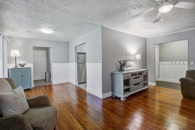 110 Terry Ave, Summerville, SC 29485 - living room with hardwood / wood-style floors, a textured ceiling, a ceiling fan, and crown molding