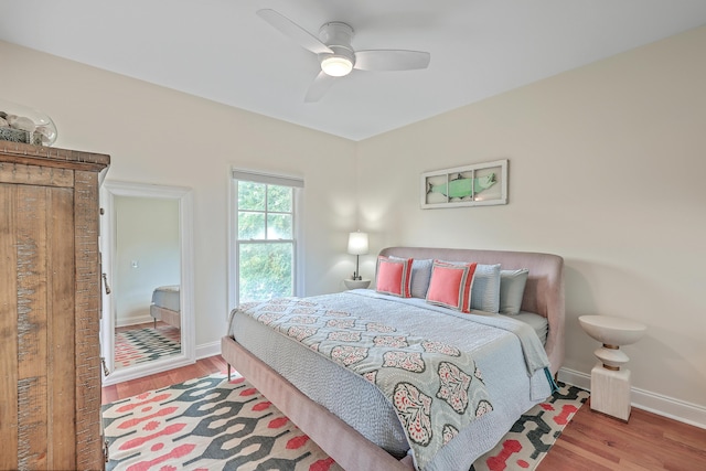 bedroom featuring ceiling fan and light wood-type flooring