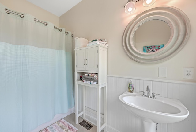 bathroom featuring tile patterned flooring and sink