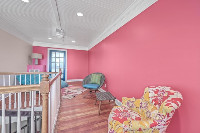 bedroom featuring ceiling fan, ornamental molding, and hardwood / wood-style flooring