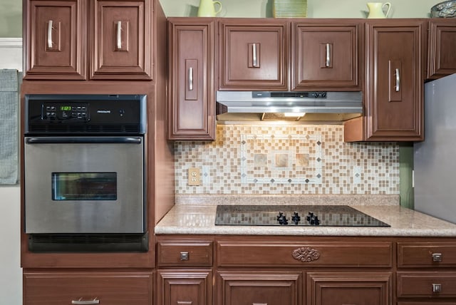 kitchen featuring appliances with stainless steel finishes and backsplash