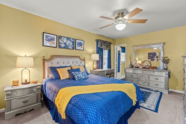 bedroom featuring light carpet and ceiling fan